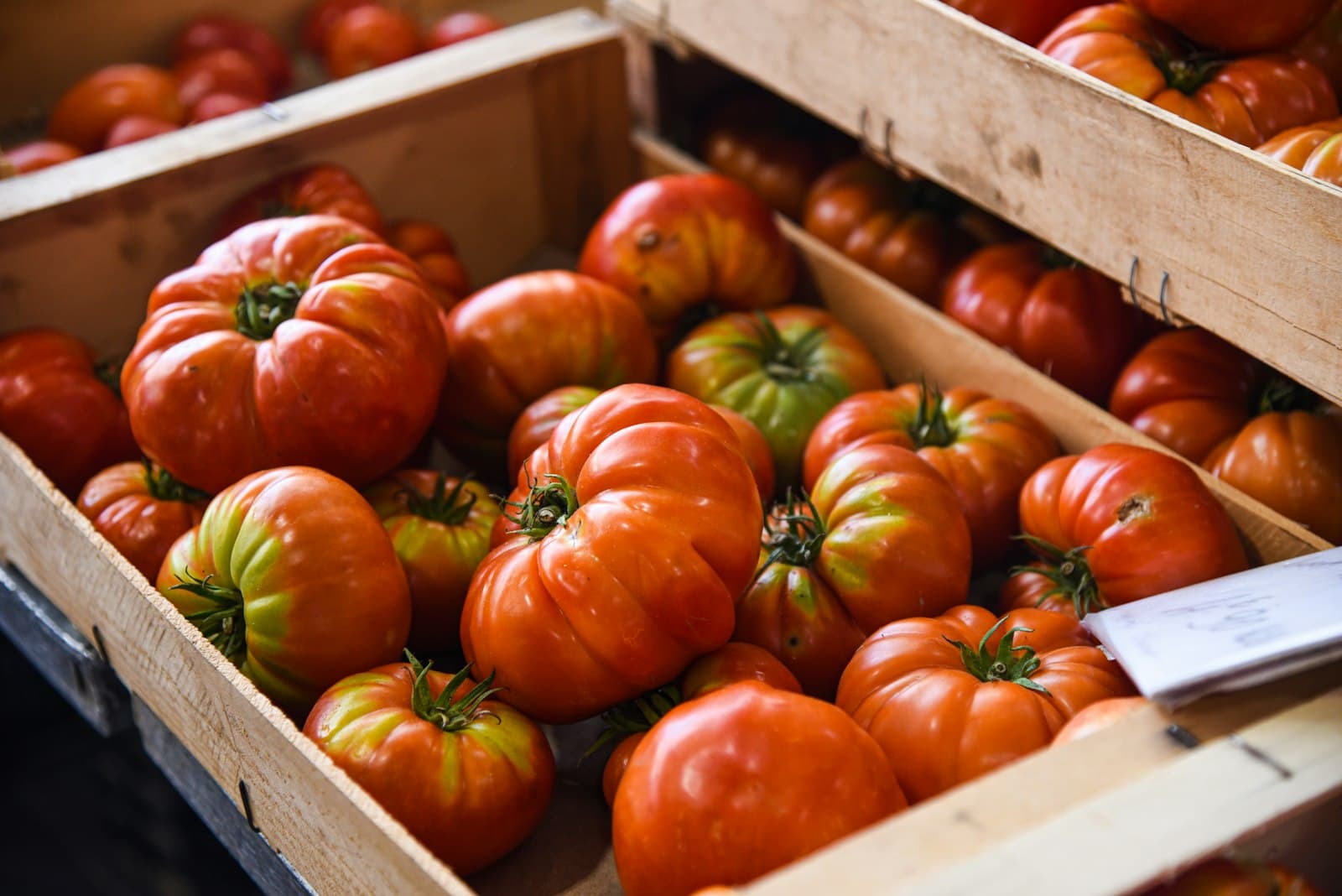 Heirloom tomatoes in wooden crates