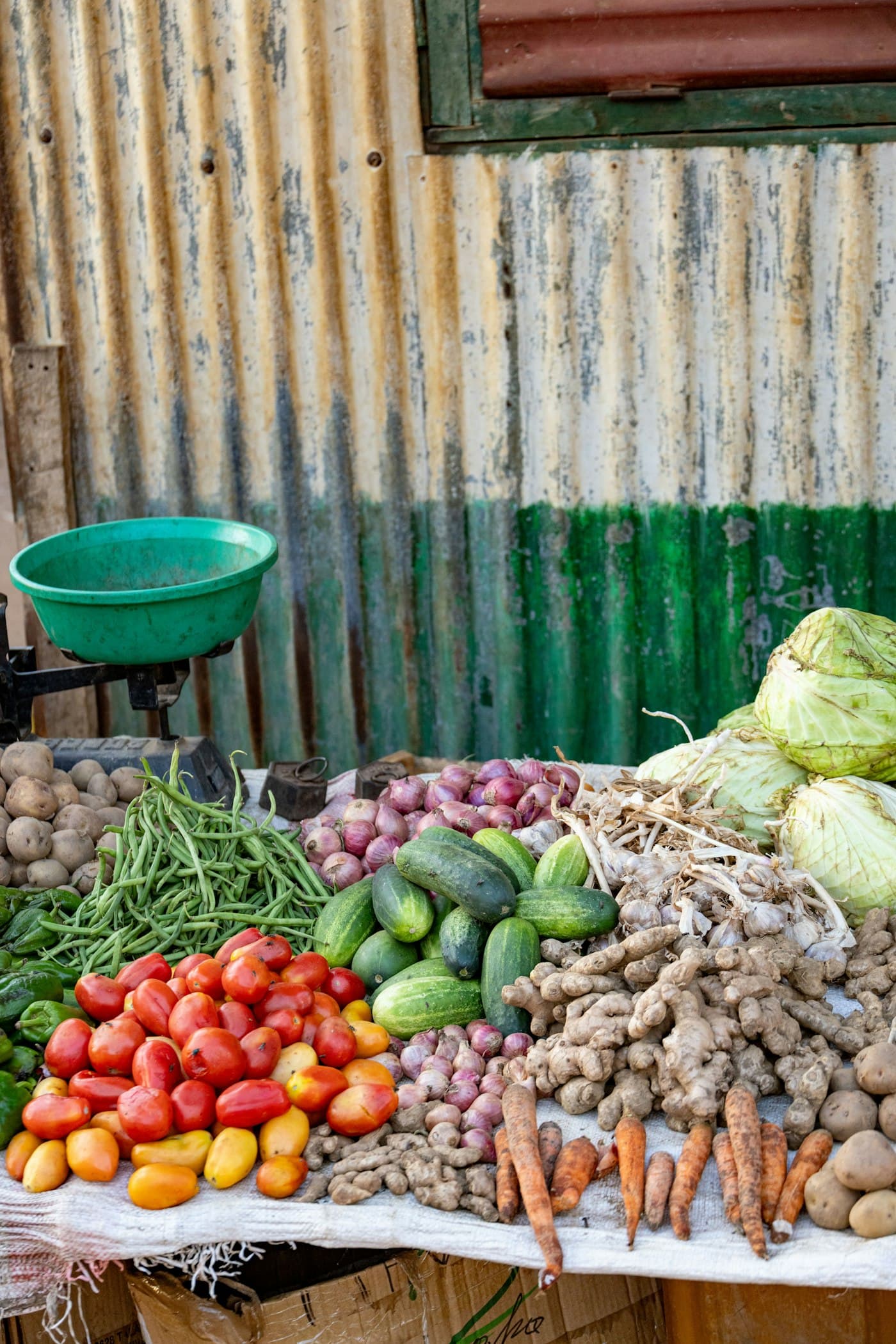 Vegetables and a scale at a market stall