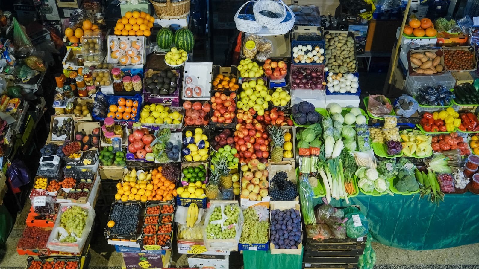 Fruit and vegetables across market stalls