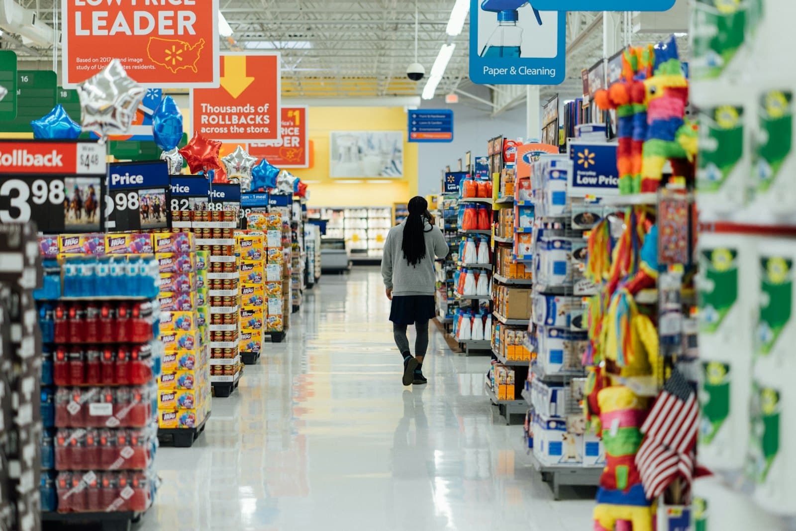 A shopper between market shelves