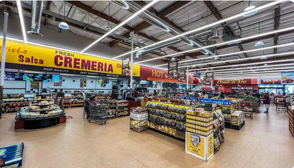 A supermarket floor with Cremería and salsa counters